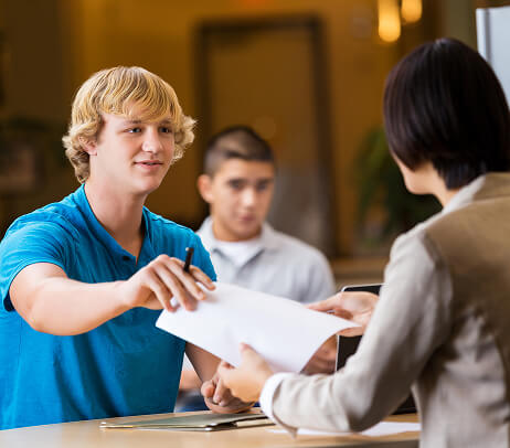 Man handing over paper