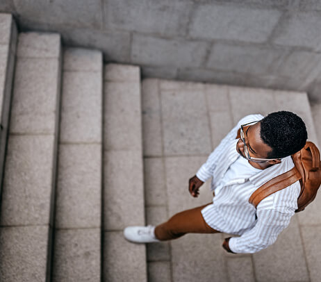 Man walking up stairs